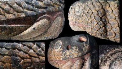 Una monumental cabeza de serpiente mexica recupera sus colores originales, tras ser desenterrada de la gran Tenochtitlan